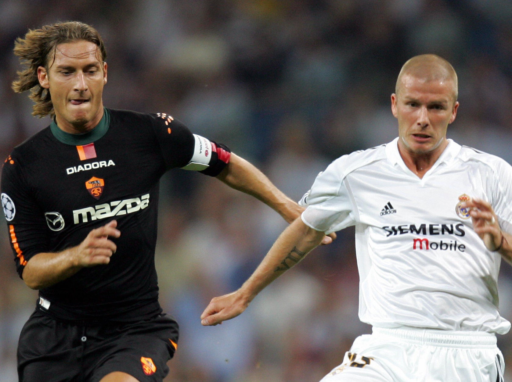 Beckham and Totti playing against one another in 2004