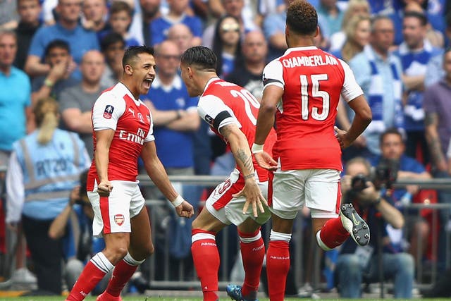 Alexis Sanchez celebrates putting Arsenal ahead in controversial circumstances early on
