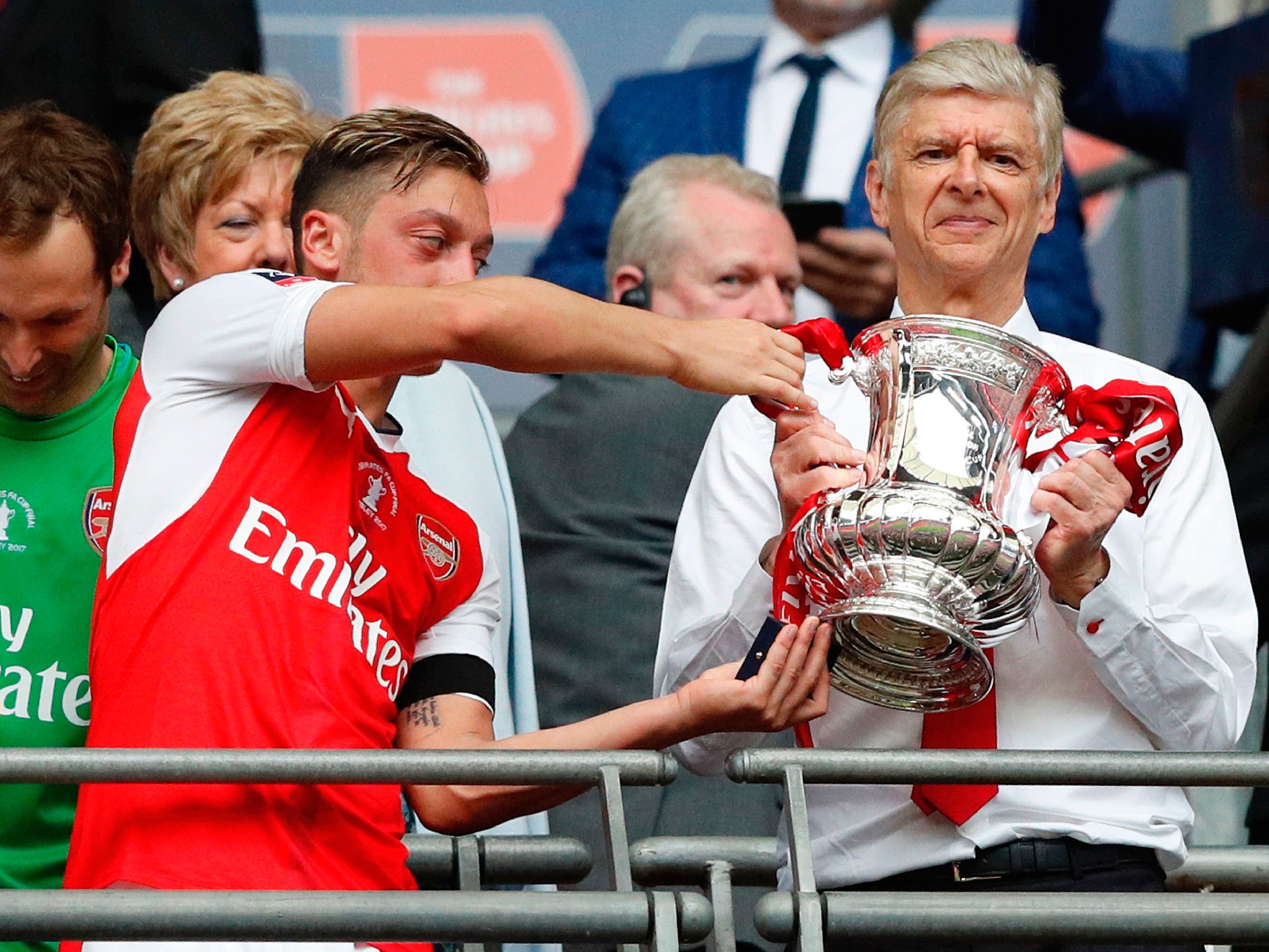 Arsene Wenger celebrates with the FA Cup trophy