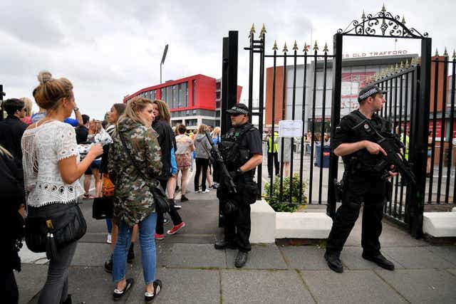 Armed police patrol around Old Trafford Cricket Ground ahead of a Courteeners concert this evening on May 27, 2017 in Manchester, England