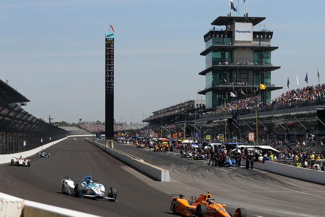 Fernando Alonso (front) could see his bid to win the Indy 500 impacted by bad weather