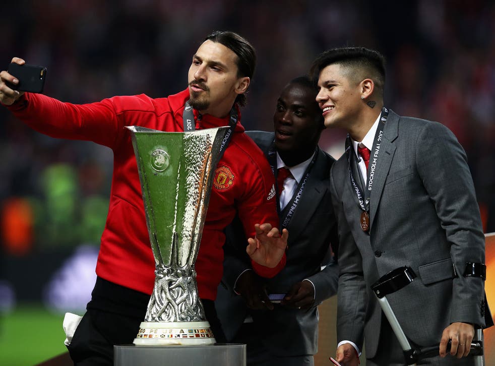 Zlatan Ibrahimovic celebrates with his teammates after United's Europa League victory in Stockholm