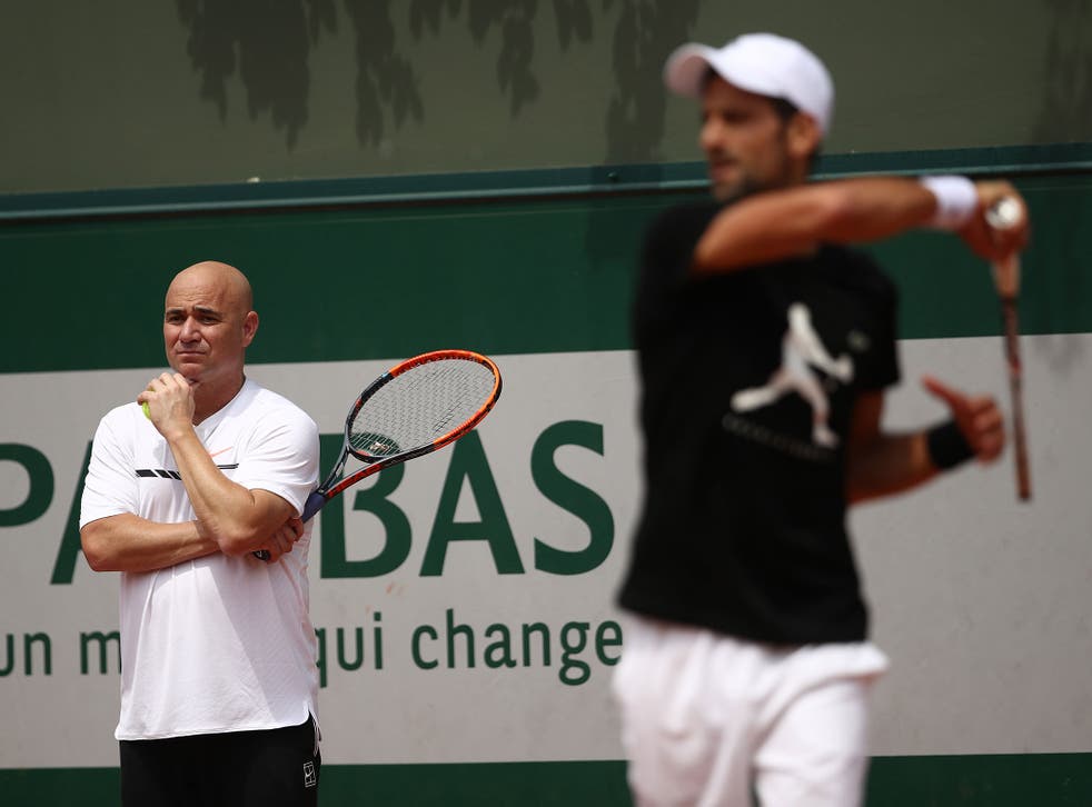 Andre Agassi watches on as Novak Djokovic trains in Paris