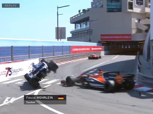 Pascal Wehrlein is flipped into the barrier by Jenson Button