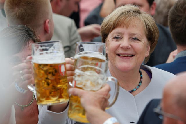 German Chancellor Angela Merkel toasts during the Trudering festival in Munich