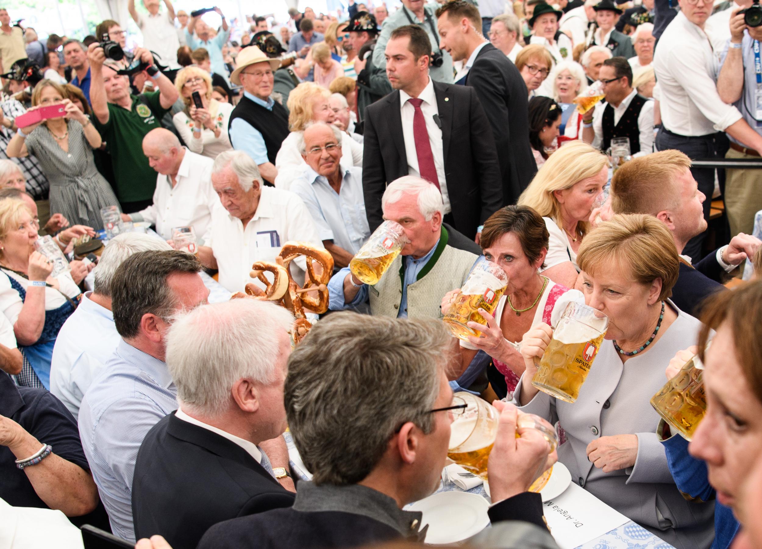 Angela Merkel joins drinkers in a beer tent in Munich on Sunday. The German Chancellor has warned that Europe can no longer rely on the US and UK in the manner it has since 1945