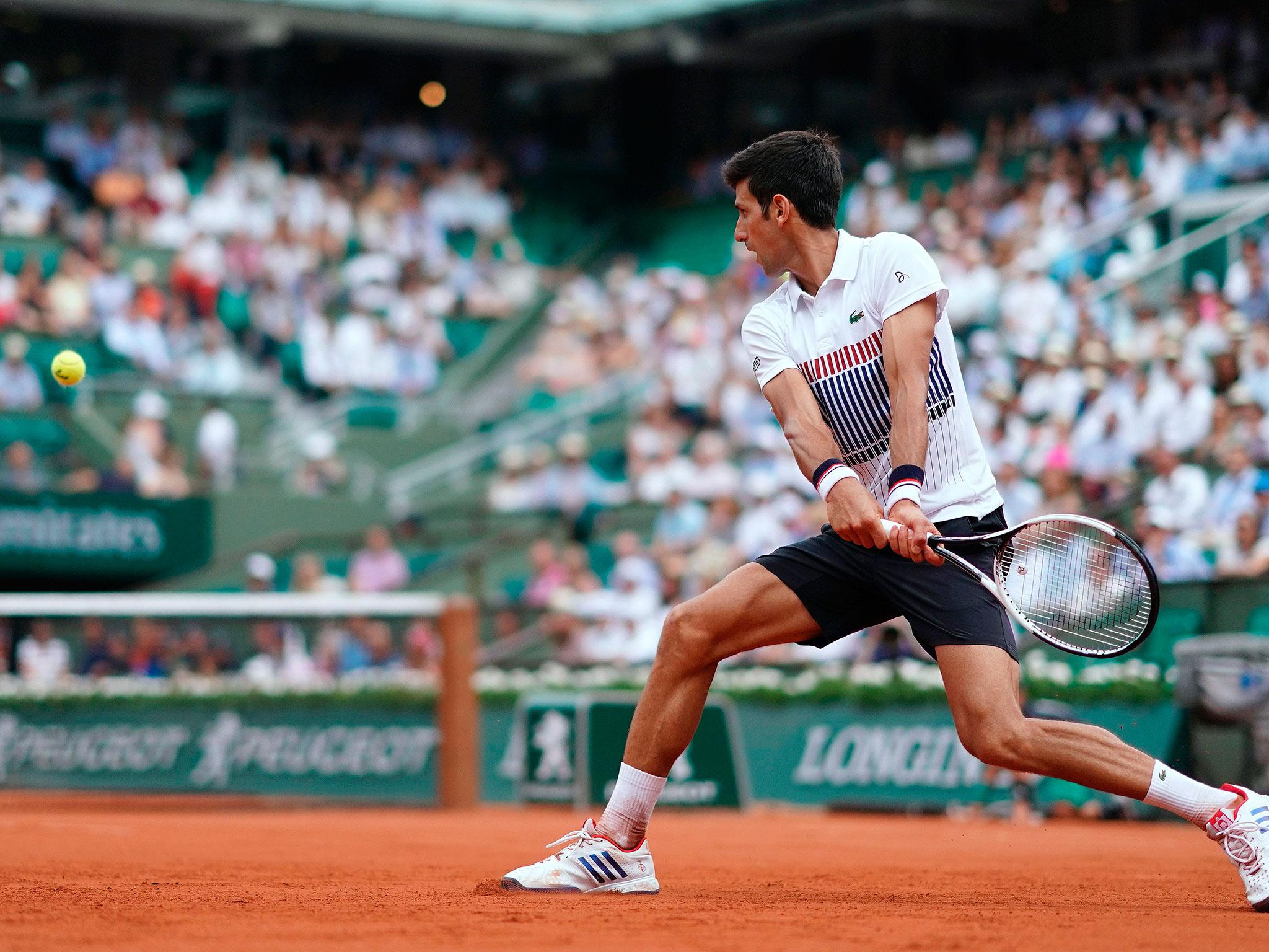 Novak Djokovic prepares to play a shot in the second set