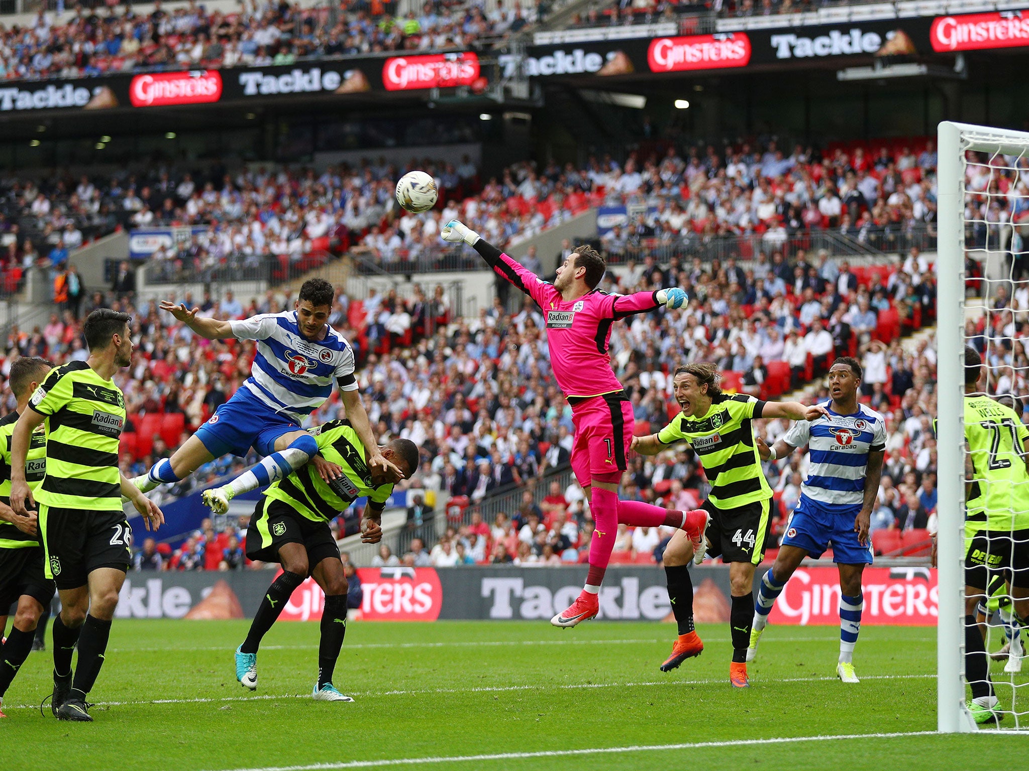 Danny Ward punches clear a Reading free-kick