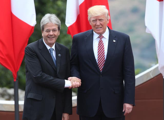 Italian Prime Minister Paolo Gentiloni shakes hands with with US President Donald Trump at the G7 Taormina summit