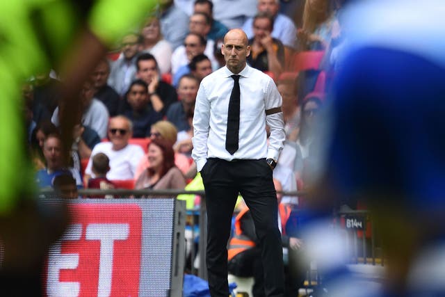 Jaap Stam looks on from the Wembley sideline