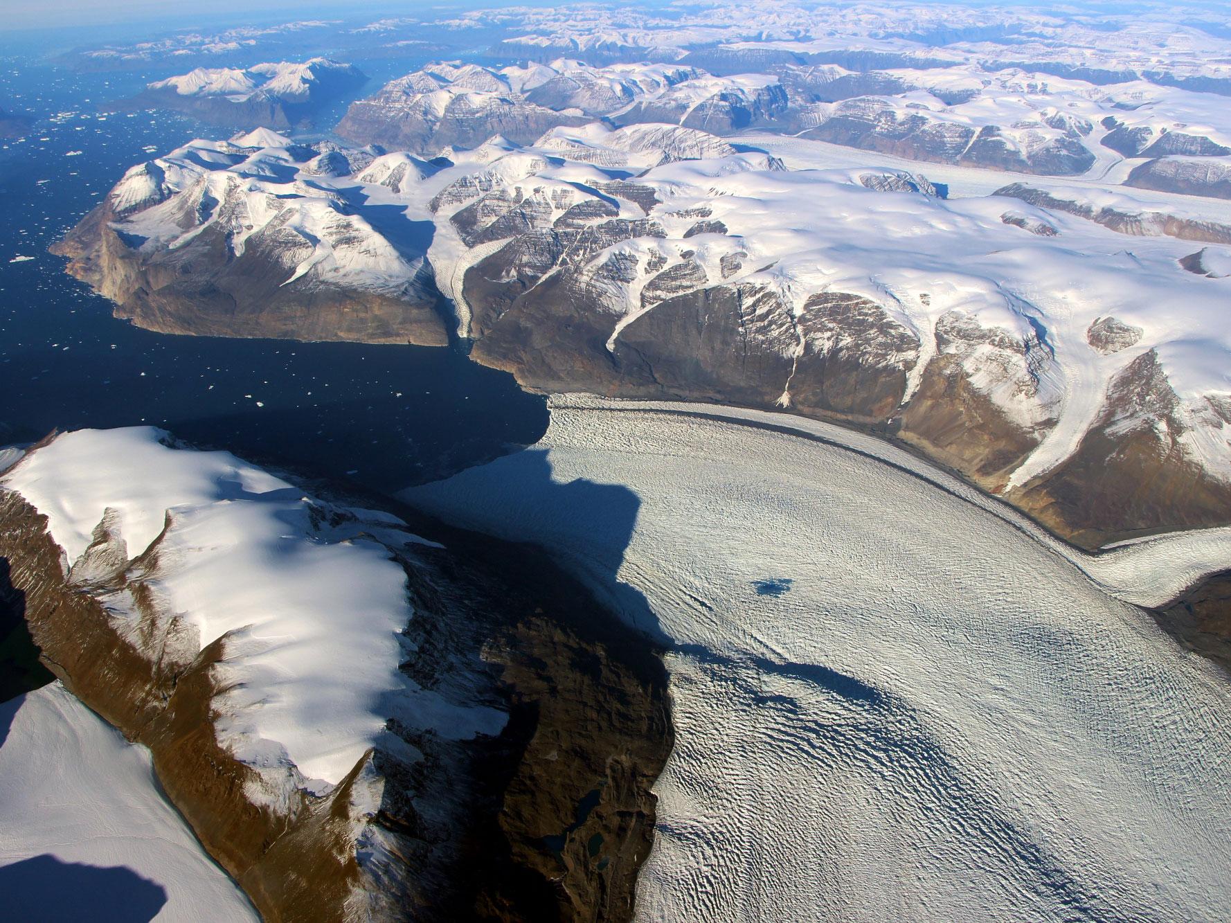 A meltwater lake can be seen on the Rink Glacier in western Greenland