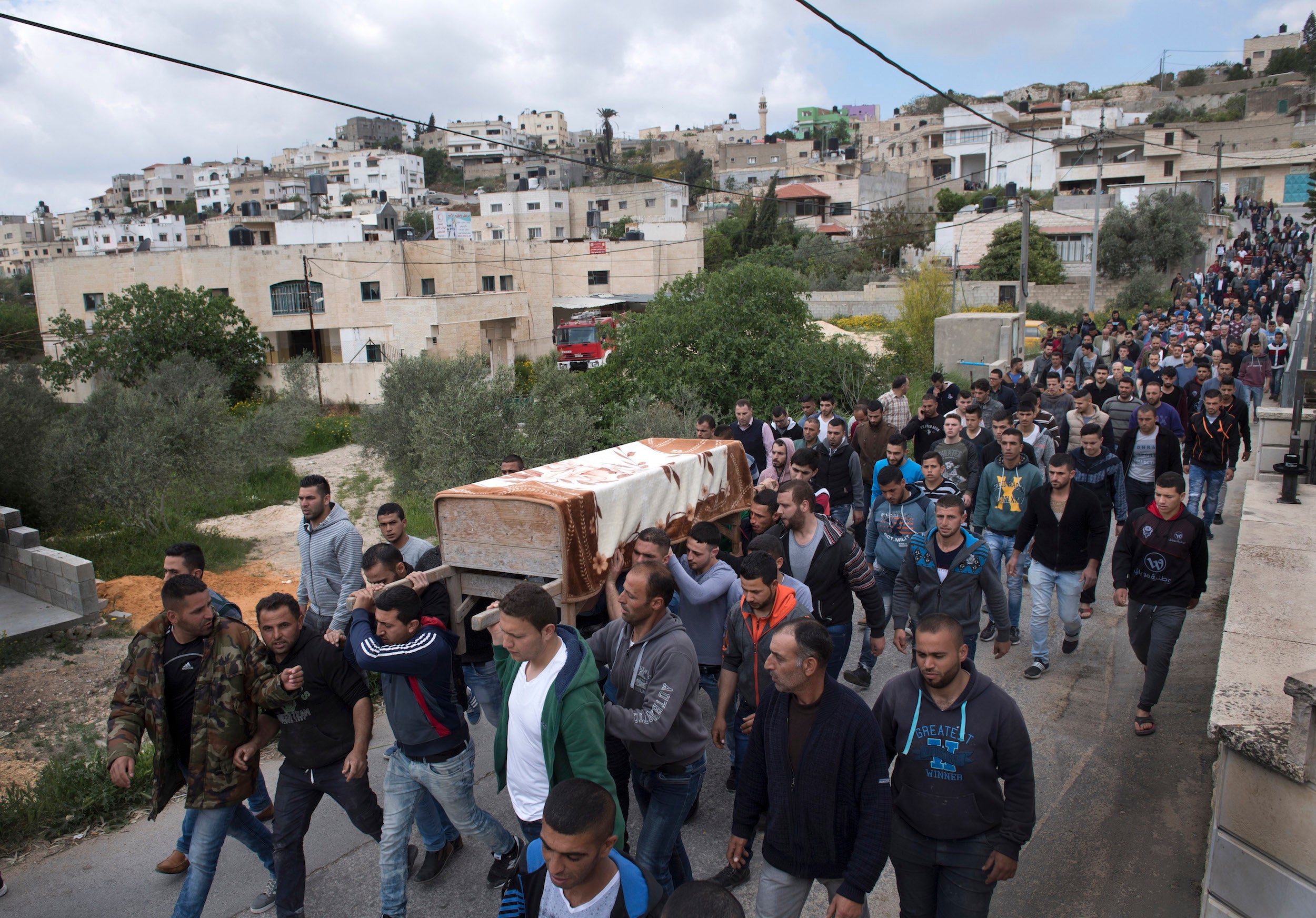 Final journey: Salah’s coffin is carried in Arraba on the West Bank