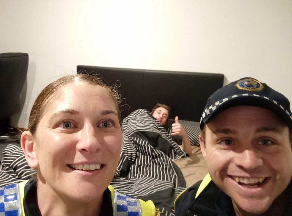 Tasmania Police officers take a selfie with a drunken Reece Park, whom they had to take home