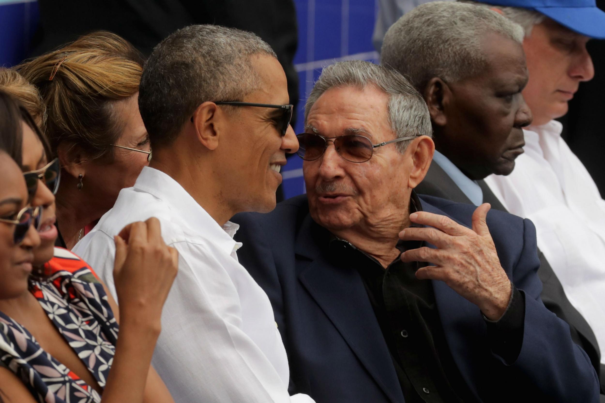 Barack Obama and Cuban President Raul Castro visit during an exposition game between the Cuban national team and the Major League Baseball team Tampa Bay Devil Rays in Havana, Cuba March 2016