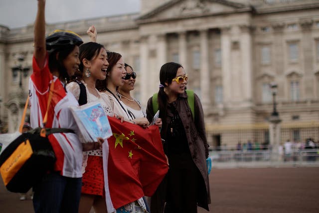 Chinese tourists outside Buckingham Palace. Visitors from the People's Republic made up 2.7 per cent of total tourism spending in the UK in 2014