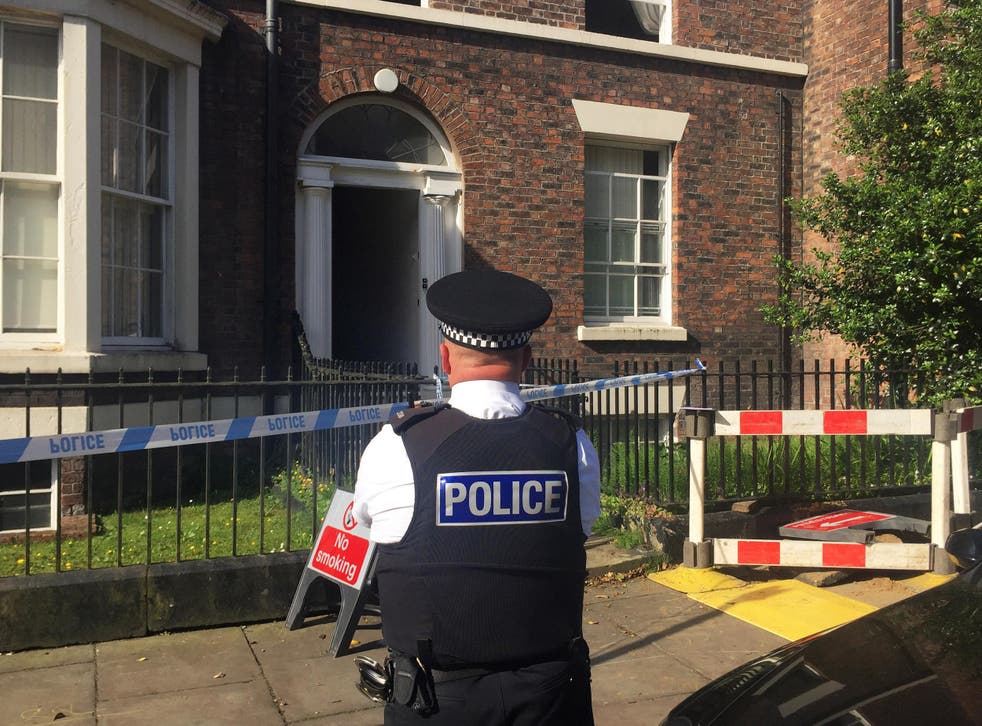 Police cordon on Falkner Street, Toxteth, after a 30-year-old man was arrested on suspicion of murder after the bodies of a woman and two children were found in the house