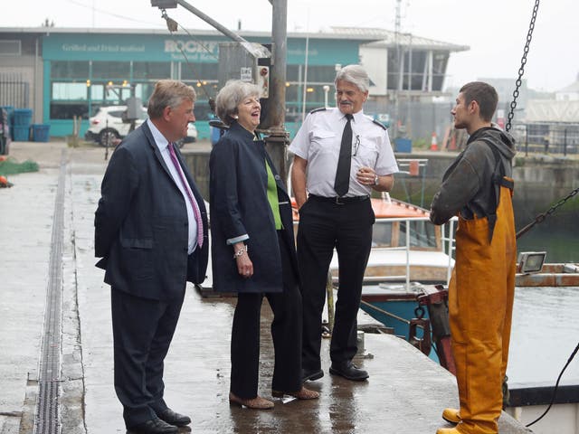 Theresa May vowed that failing to regain fishing rights from December 2020 would be a 'betrayal of Scotland', the MPs say