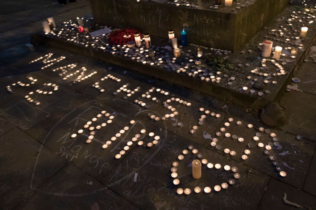 Memorial candles are seen during a vigil on St Ann's Square in Manchester, on 29 May, 2017 (Photo: Getty) (AFP/Getty Images)