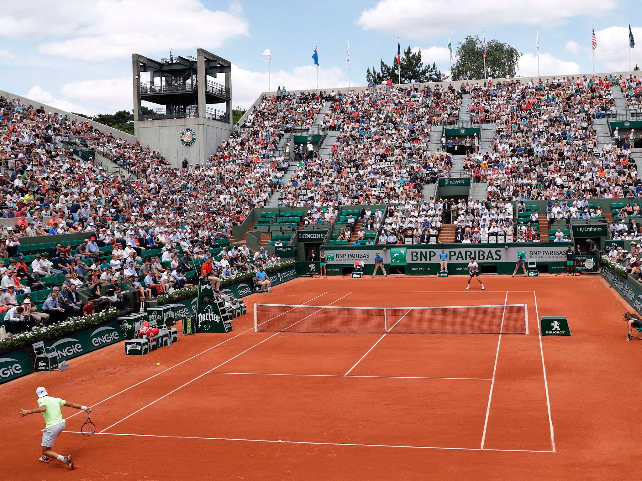  Sousa returns a Djokovic shot in the second set 