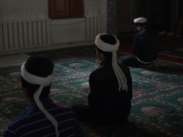 Muslim men in Xinjiang praying during Ramadan in 2015