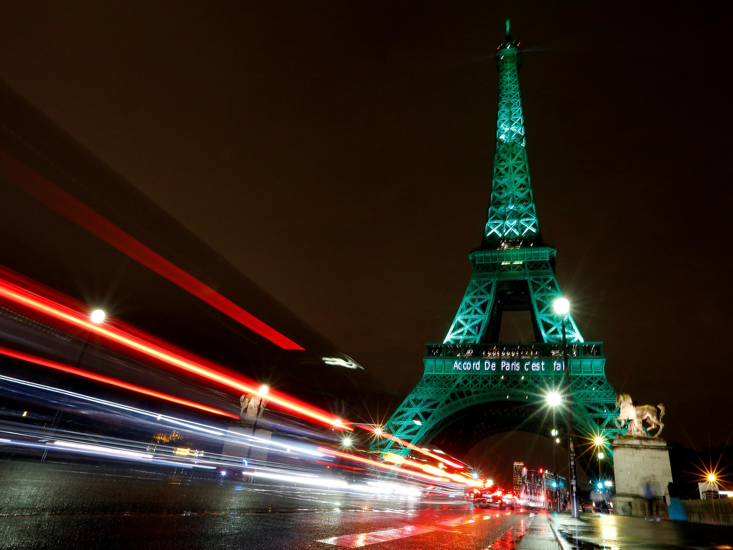 The Eiffel Tower is illuminated in green in 2016
