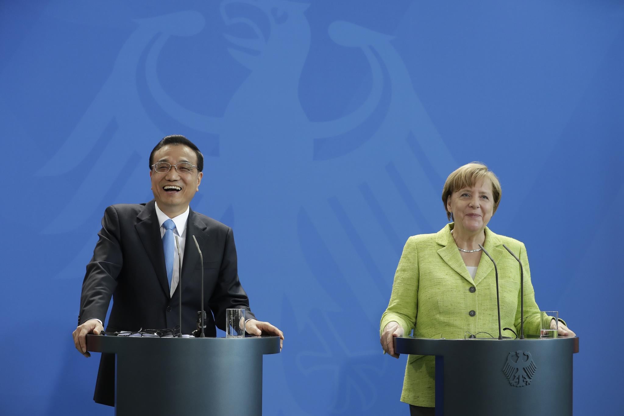 German Chancellor Angela Merkel and China's Premier Li Keqiang address the media during a joint press conference