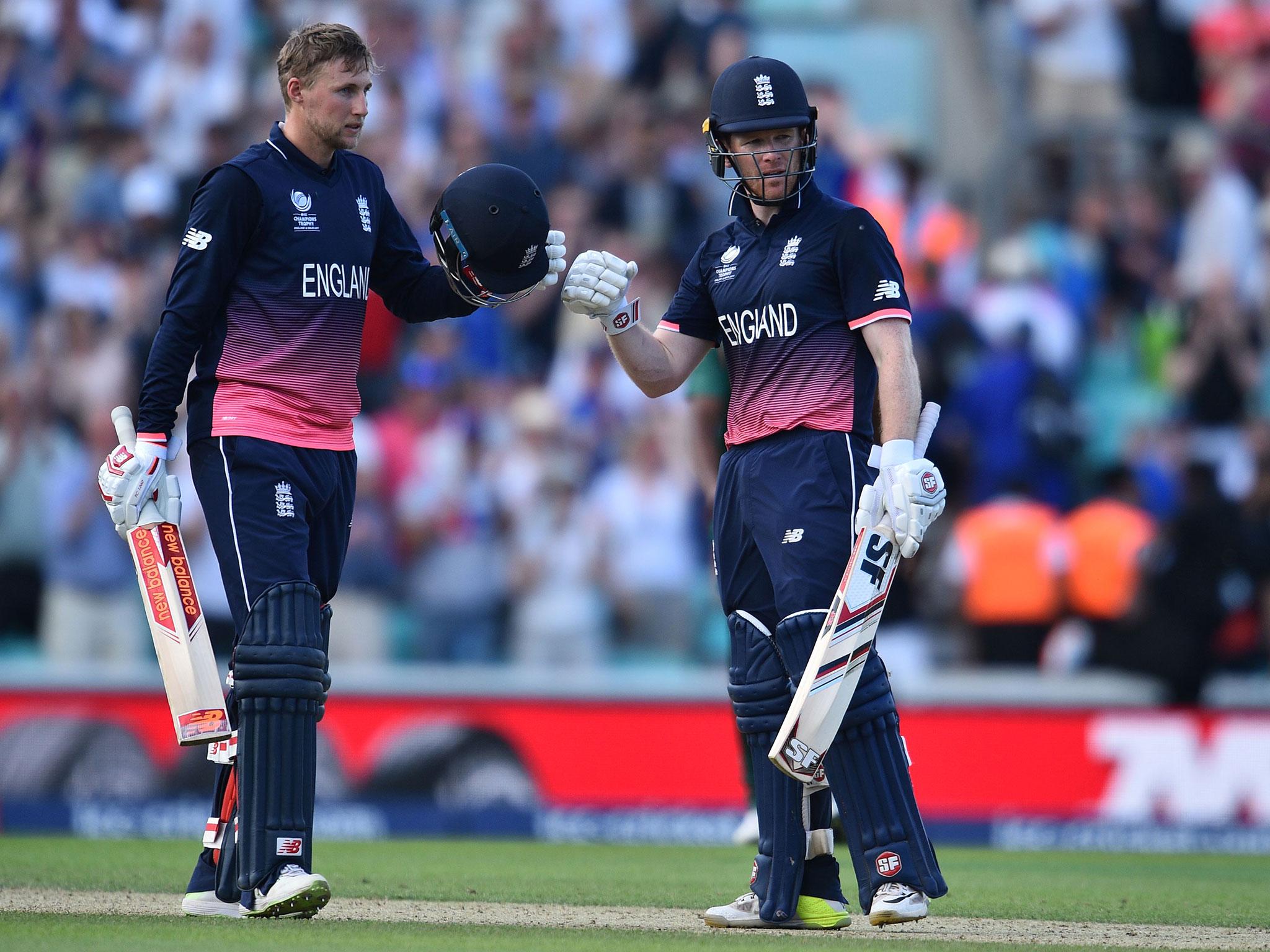 &#13;
Morgan and Root celebrate after securing victory &#13;