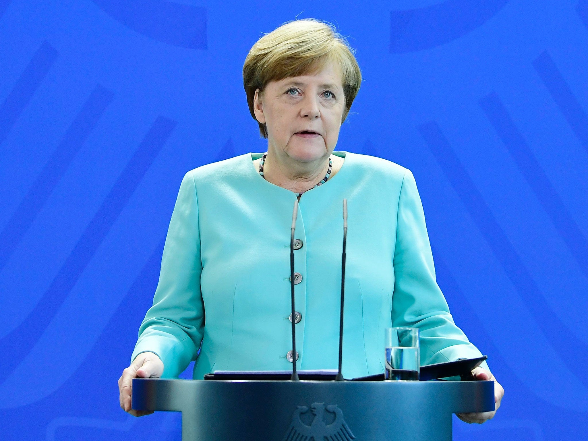 German Chancellor Angela Merkel gives a statement where she pledged "more decisive action than ever" on climate on June 2, 2017