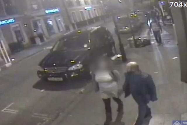 CCTV footage showing one of the men in question walking and holding hands with the woman, who was later raped
