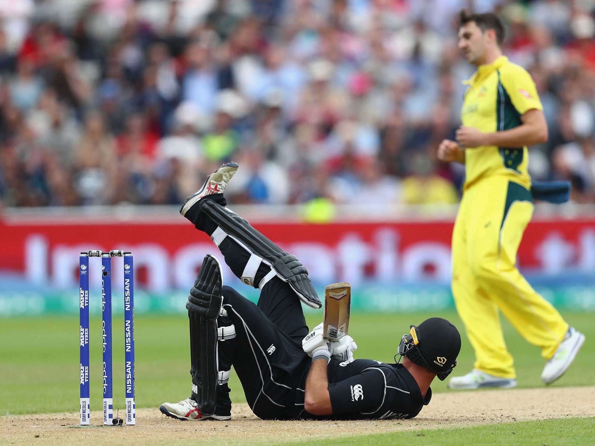 Corey Anderson hits the turf after avoiding a delivery from Mitchell Starc