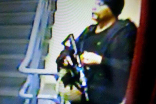 The gunman, described as being in his 40s and at least 6ft tall, was carrying what police say is an M4 assault rifle