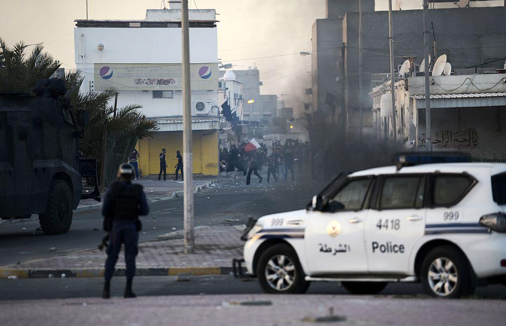 Protesters throw stones towards riot police during clashes in the Shiite village of Shahrakkan, south of Manama, in this file photo from 5 April 2016