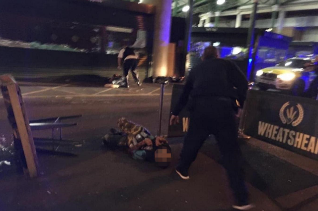 Image shows two men lying on the ground after having reportedly been shot by the police in what is believed to be linked to terrorist attacks in the centre of London