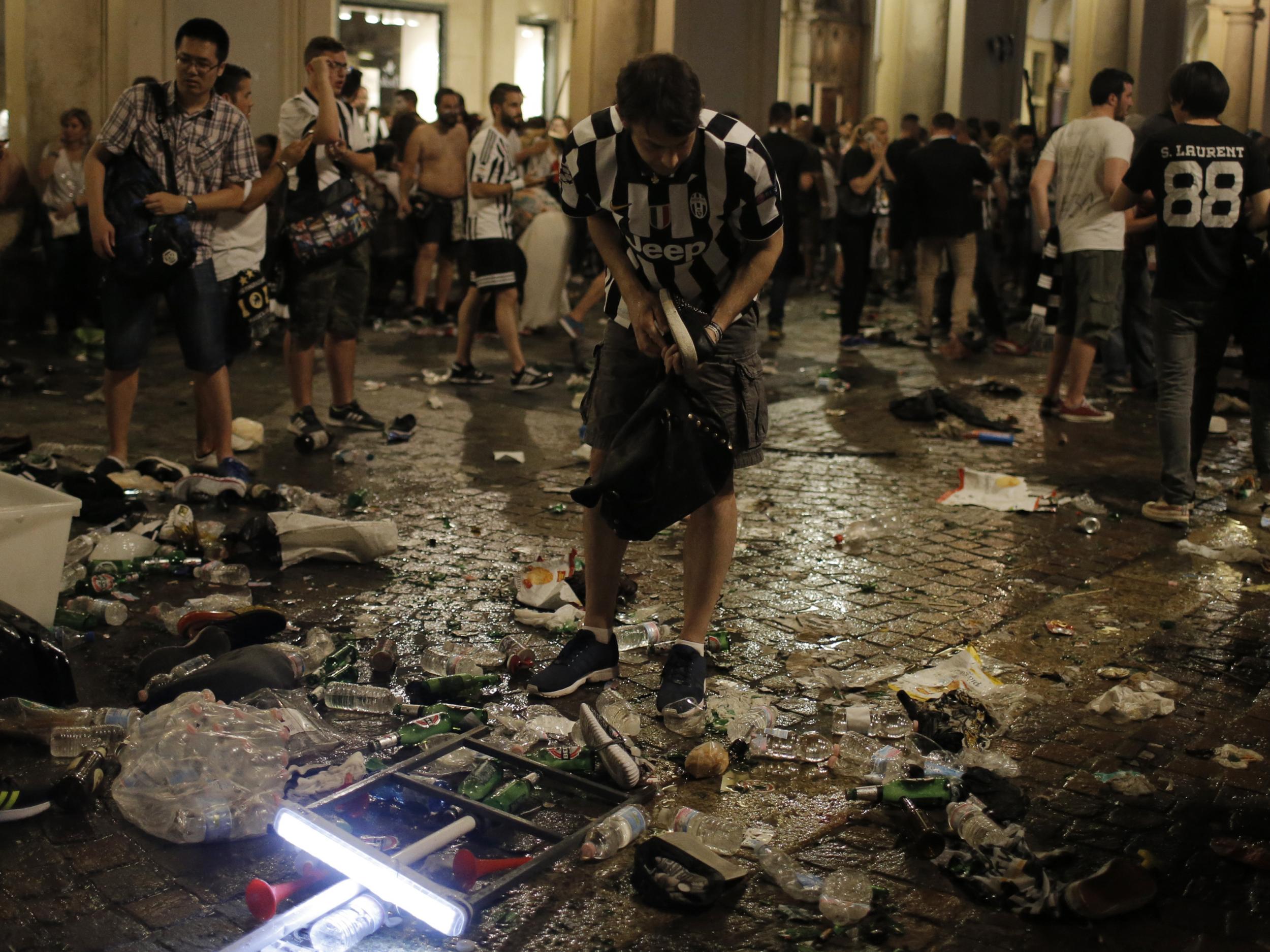 A supporter surveys the wreckage