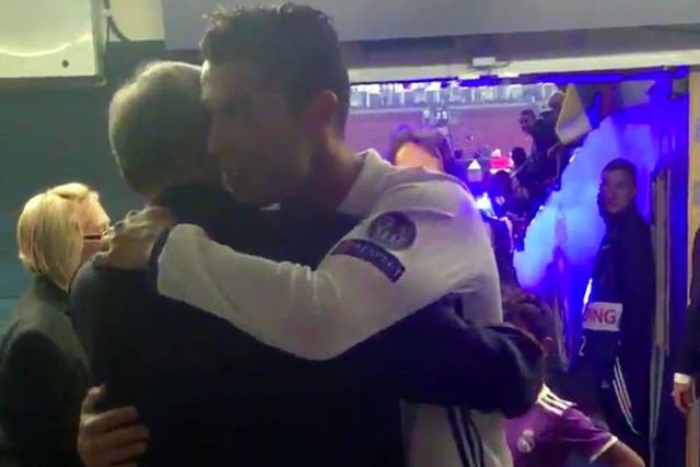 Ronaldo embraces his former manager after the full-time whistle