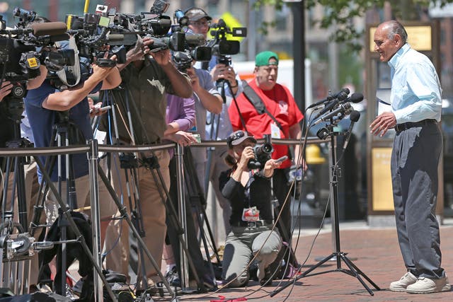 Ralph DeMasi addresses the press outside a Boston courtroom
