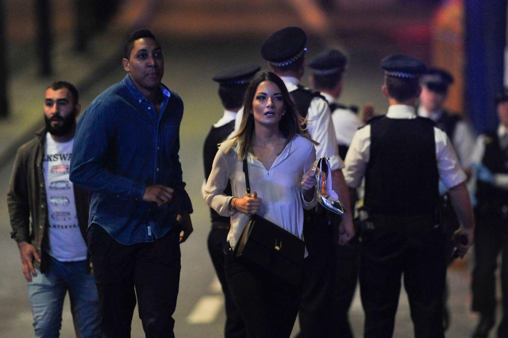 Members of the public leave the scene of a terror attack on London Bridge on 3 June 3 2017