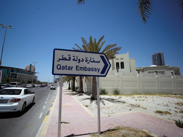 A road sign giving directions to Qatar's embassy in Manama, Bahrain