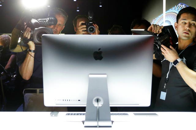 Members of the media photograph a prototype iMac Pro during the annual Apple Worldwide Developer Conference (WWDC) in San Jose, California, U.S. June 5, 2017