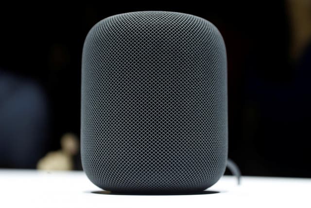 The HomePod, notably not on a wooden surface that would show marks