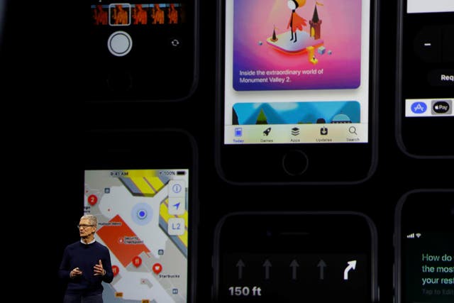 Apple CEO Tim Cook speaks on stage during Apple's annual Worldwide Developer Conference (WWDC) in San Jose, California