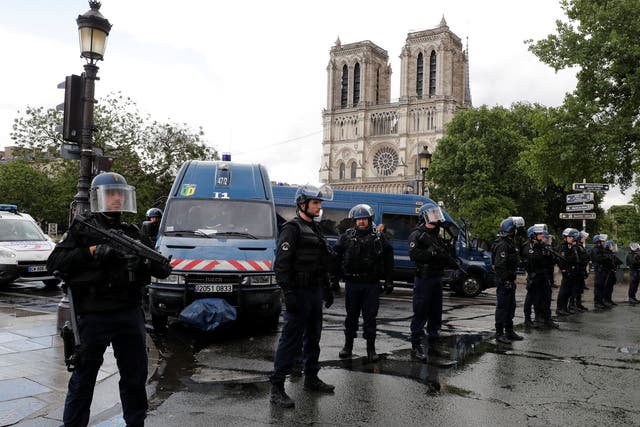 French police stand at the scene of a shooting incident near the Notre Dame Cathedral in Paris, France, June 6, 2017.