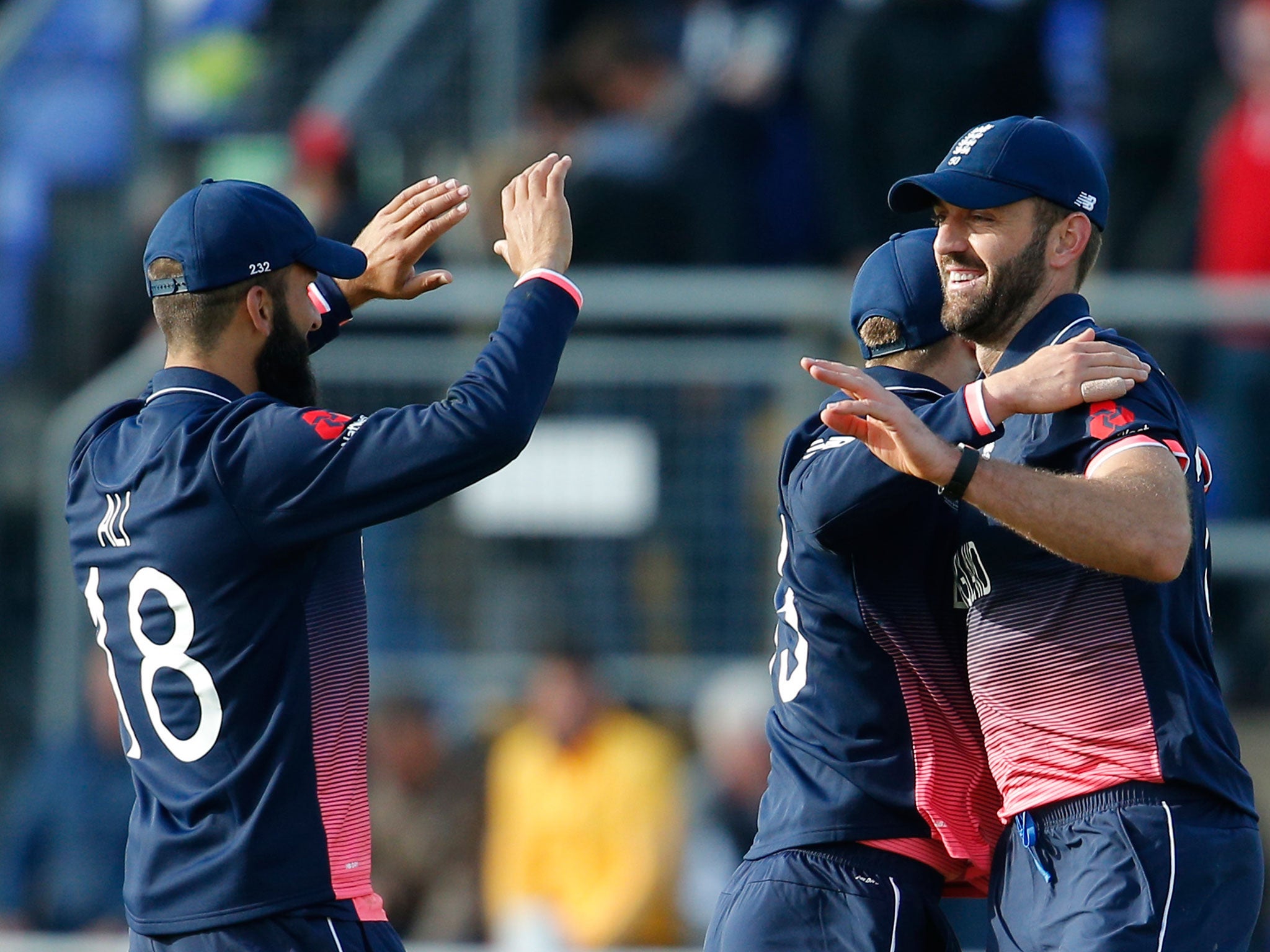 Liam Plunkett celebrates with teammates after beating New Zealand