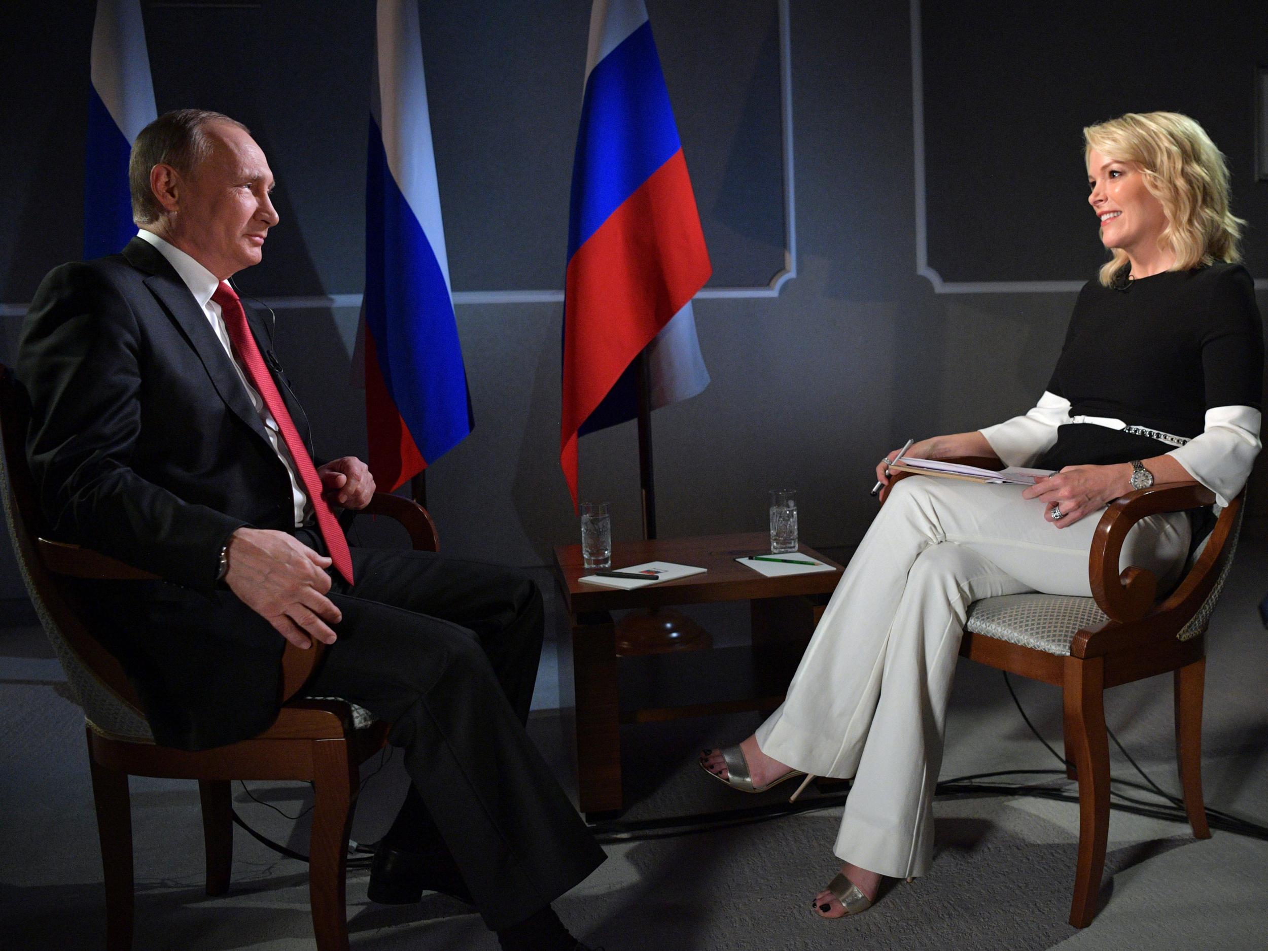 Russian President Vladimir Putin speaks with journalist Megyn Kelly during an interview on the sidelines of the St Petersburg International Economic Forum on 3 June 2017