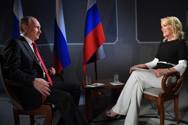Russian President Vladimir Putin speaks with journalist Megyn Kelly during an interview on the sidelines of the St Petersburg International Economic Forum on 3 June 2017