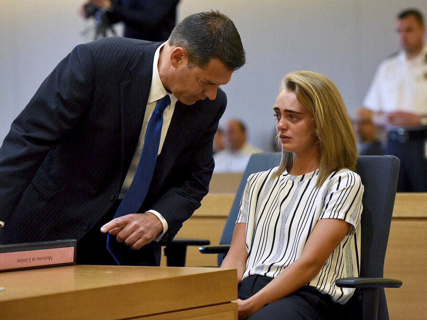 Defence lawyer Joseph Cataldo talks to his client, Michelle Carter, during the trial
