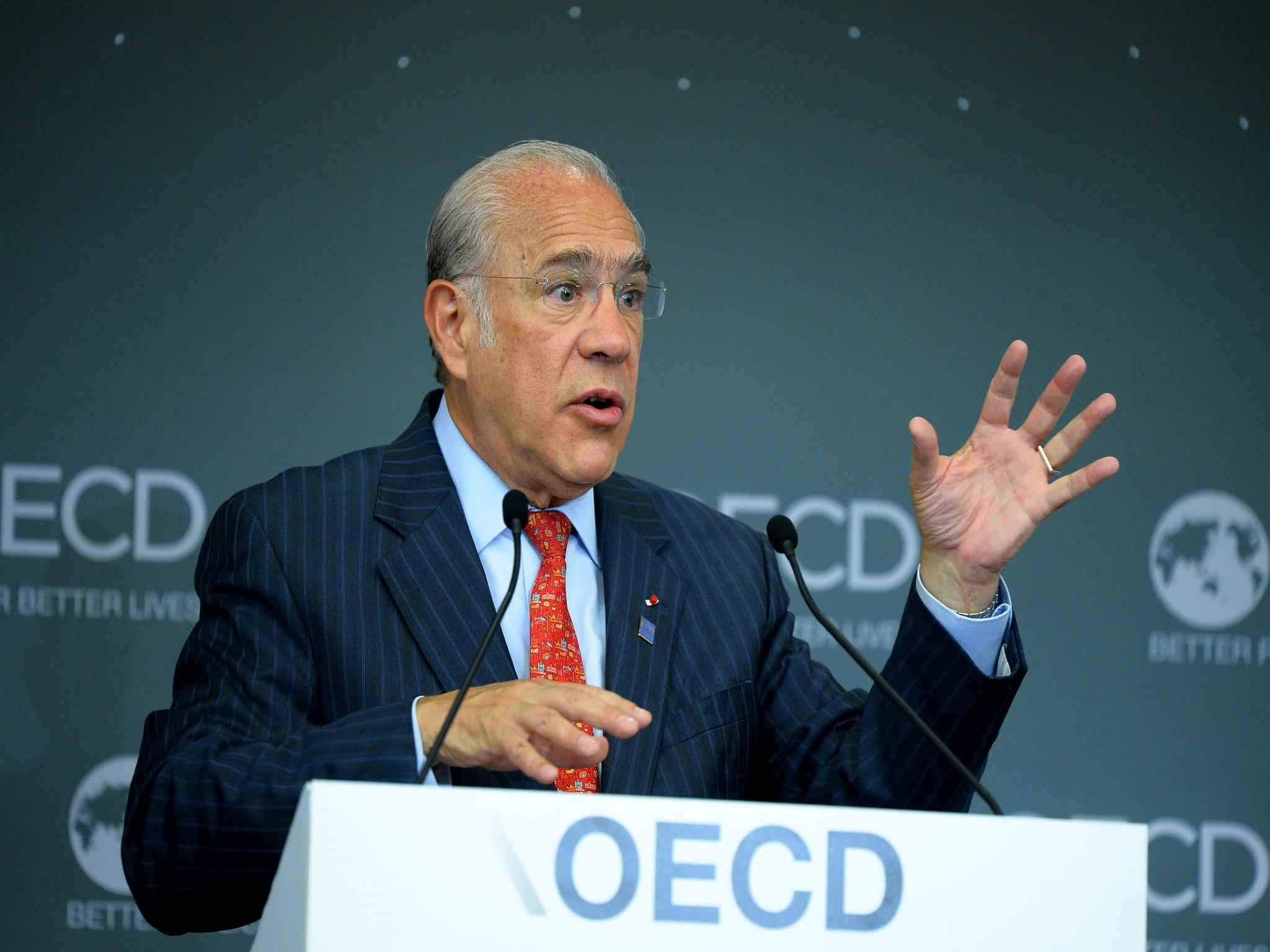 OECD General Secretary Angel Gurria unveils its latest Global Economic Outlook in Paris