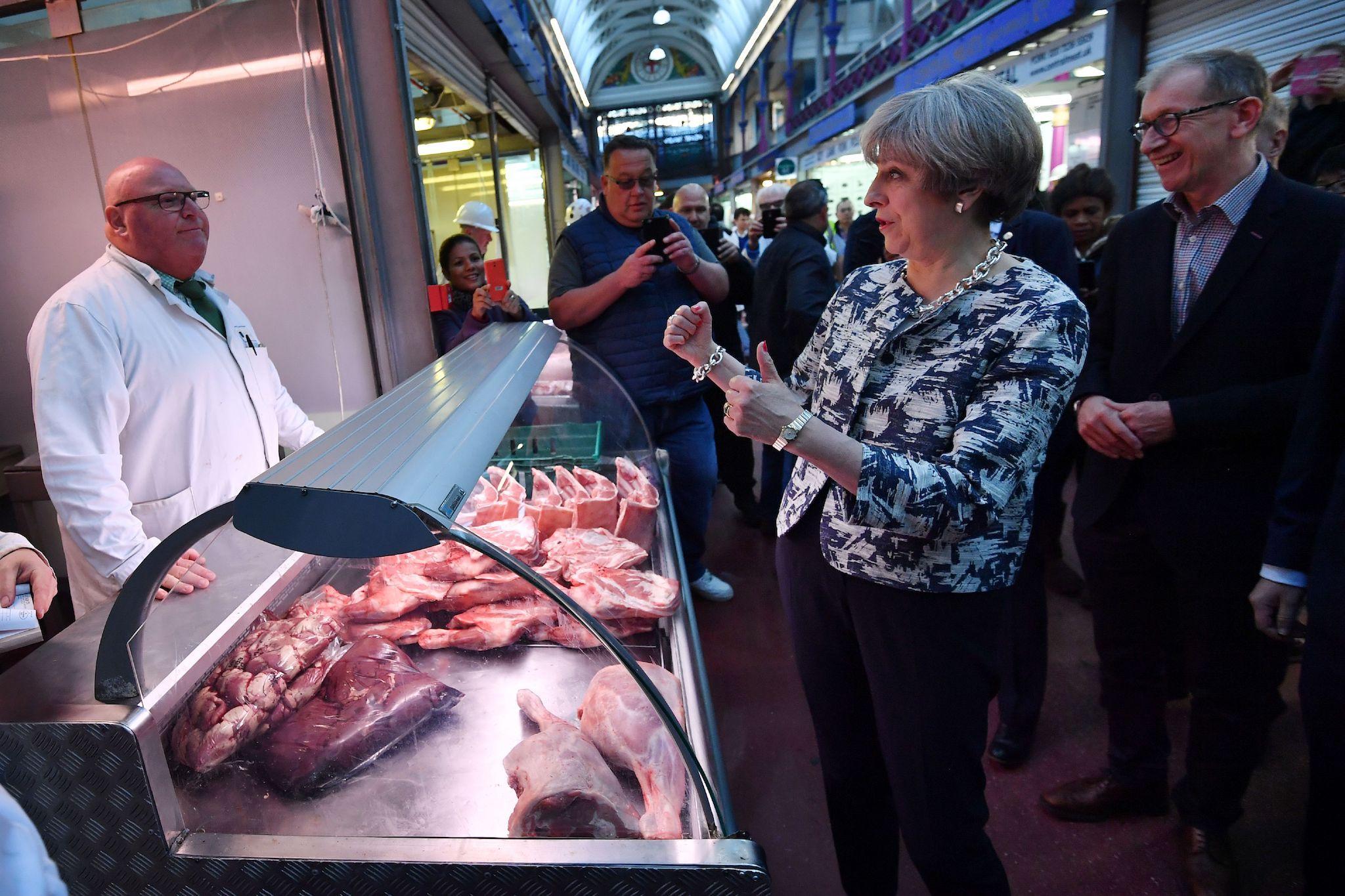 Theresa May and her husband Philip visit Smithfield meat market in London on the final day of the election campaign