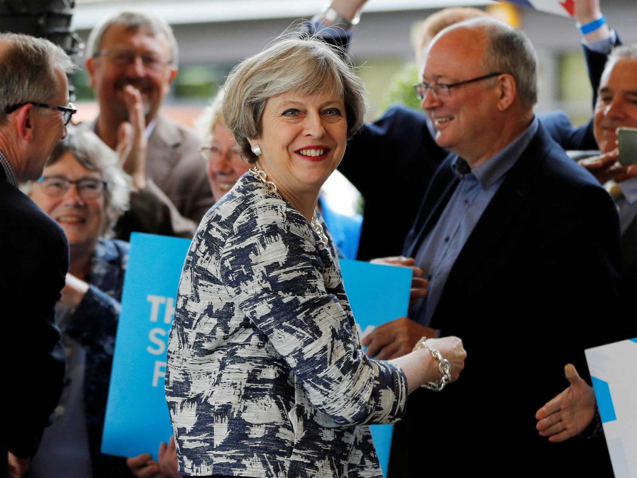 Theresa May arrives with her husband Philip at an election campaign event in Solihull