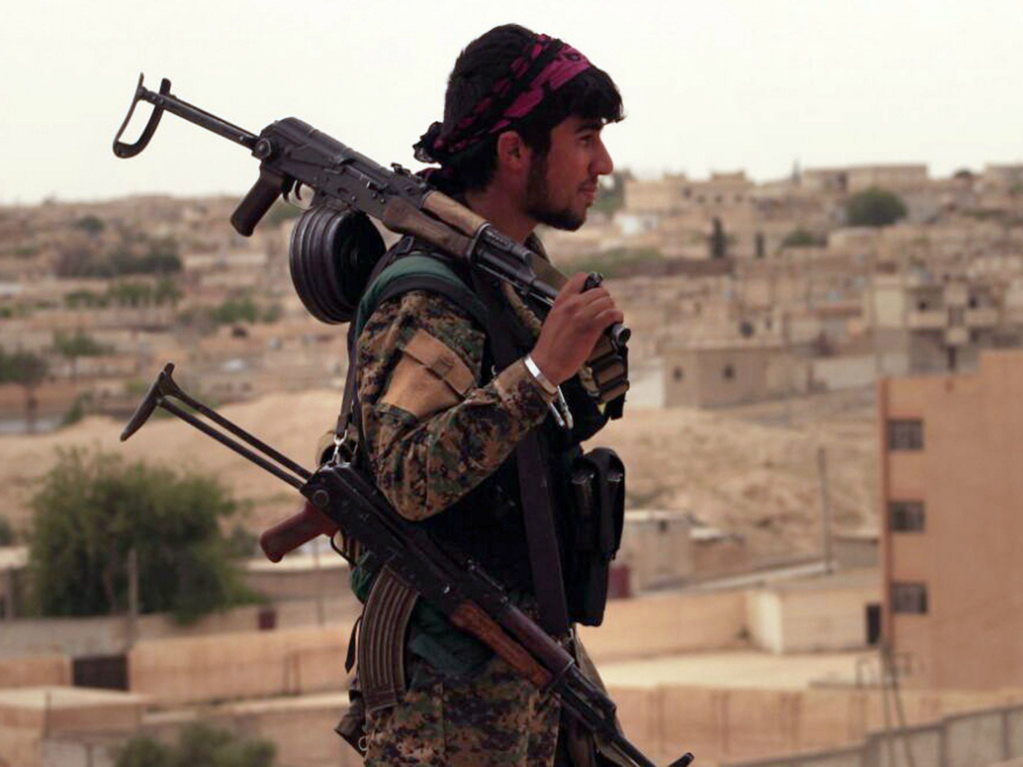 A fighter from the Syrian Democratic Forces on his way to Raqqa